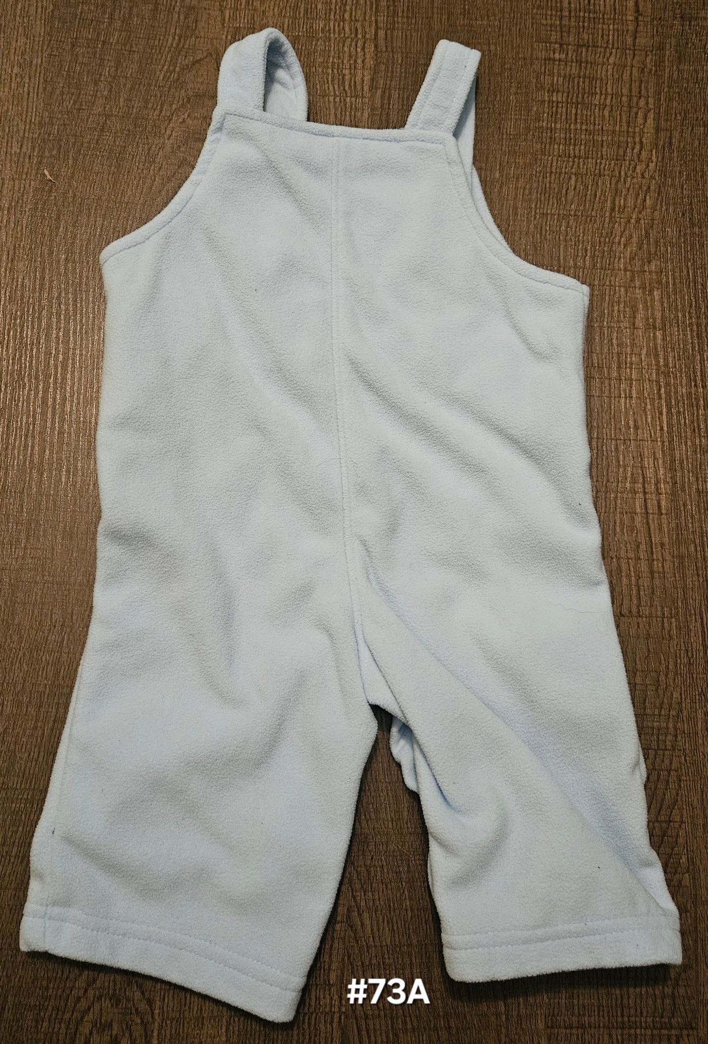 Blue Overalls With A Bear On Them