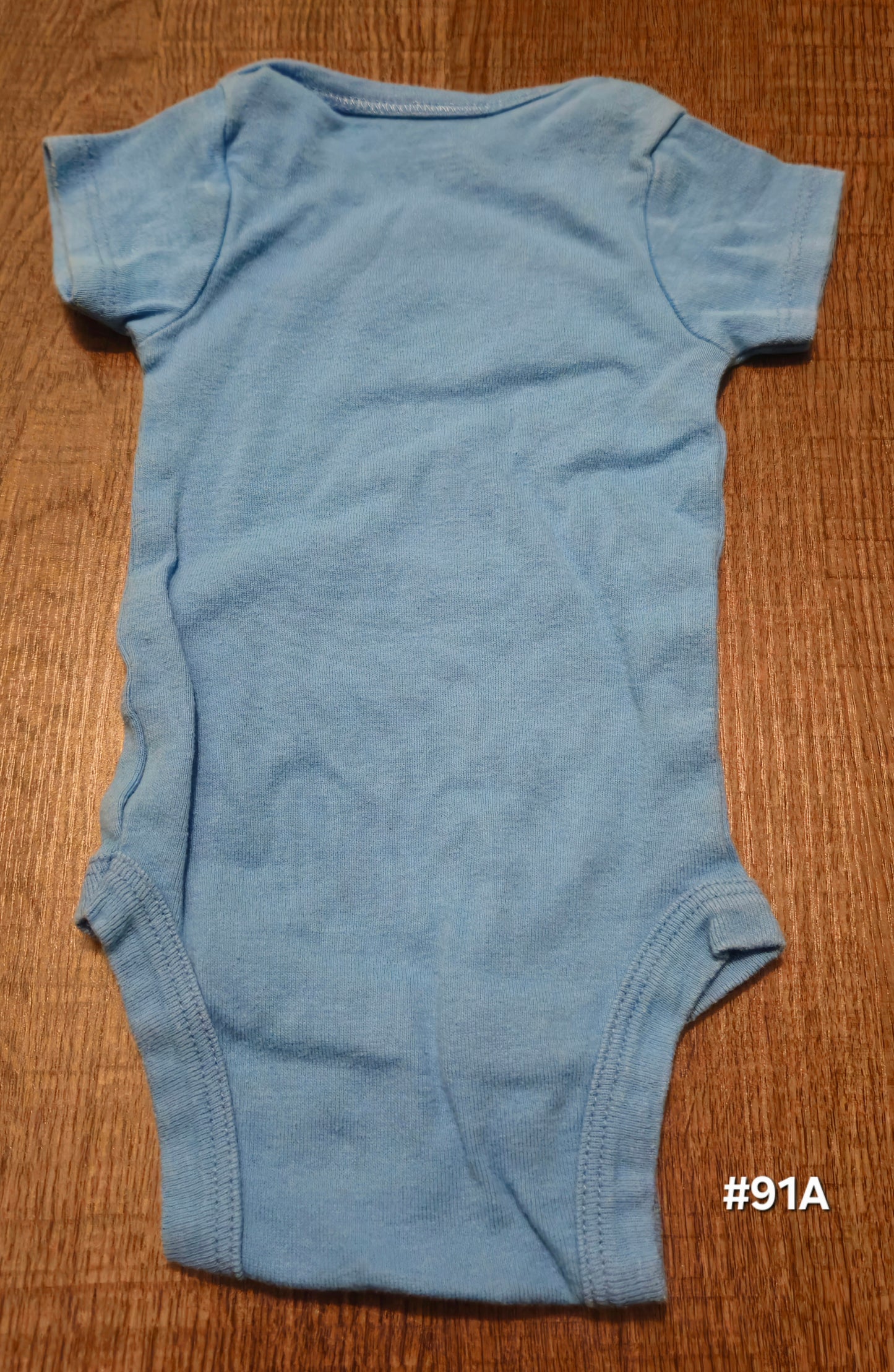 Blue Onesie With A Football On It