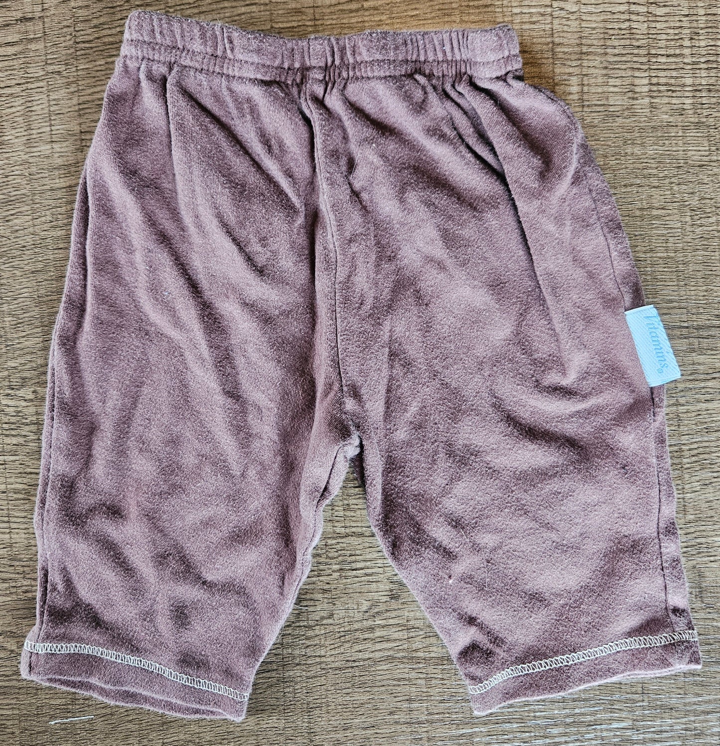 Brown Pants With Blue Shape On Them
