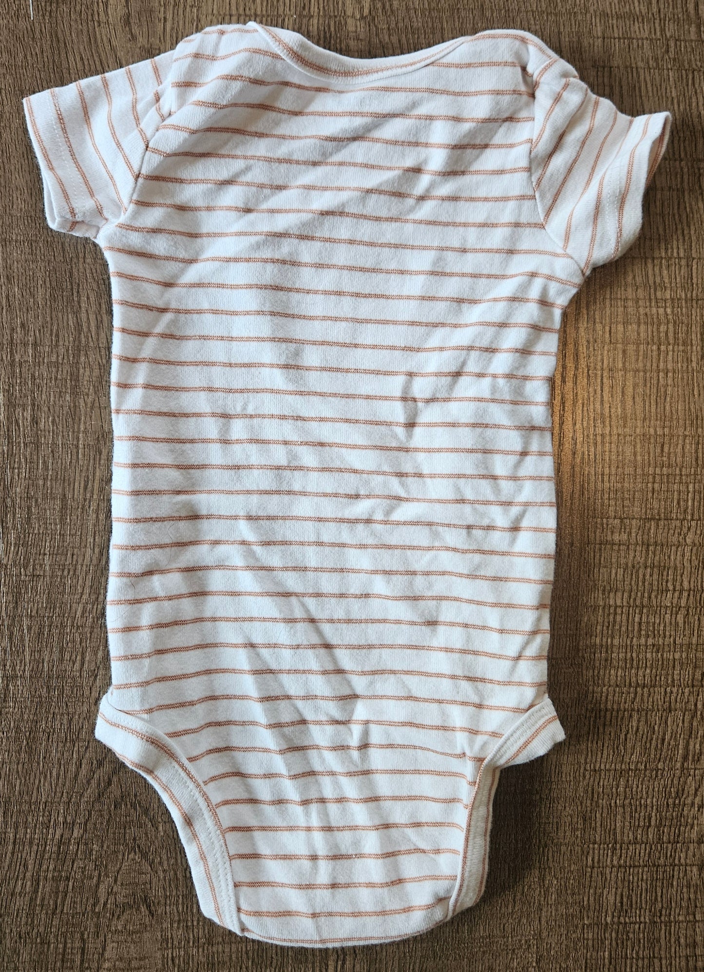 A White Onesie With Brown Stripes And A Koala That Says "Hello Little One"