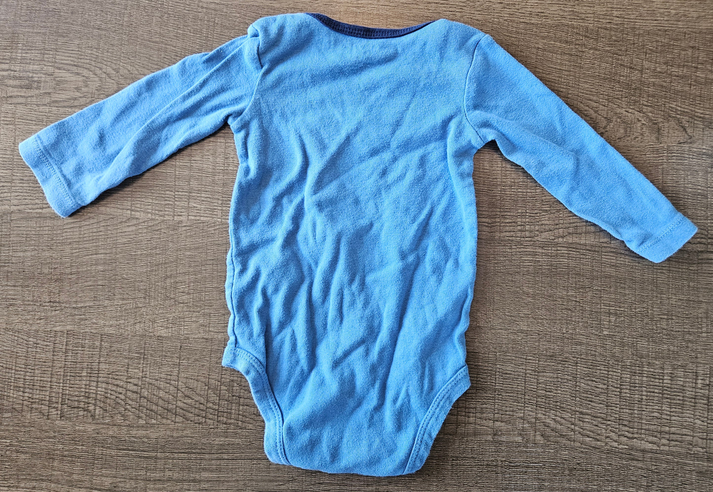 Blue Sleeper That Says "Daddy's Little Monster"
