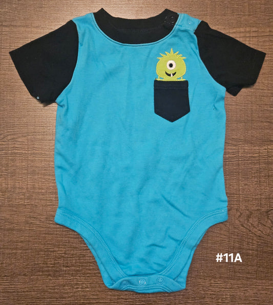 Blue Onesie With A Monster In The Pocket