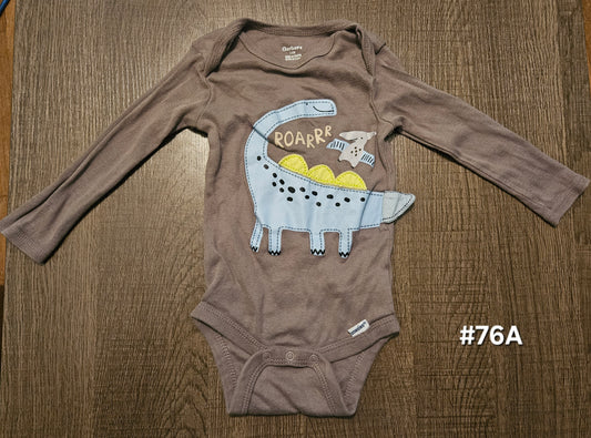 Brown Long Sleeve Onesie With A Dinosaur On It